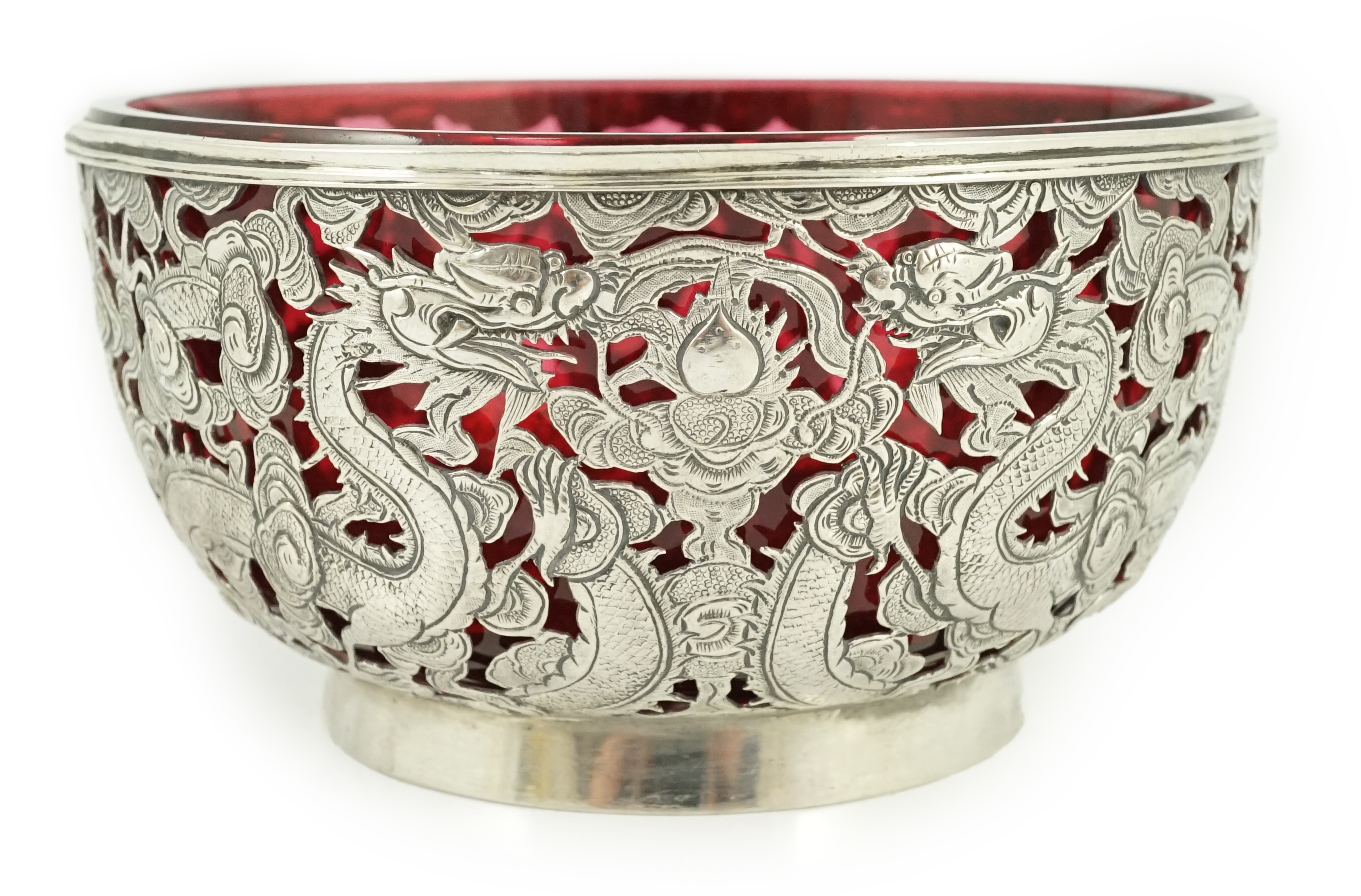 A late 19th/early 20th century Chinese Export pierced silver bowl, by Wang Hing, Hong Kong, with ruby glass liner